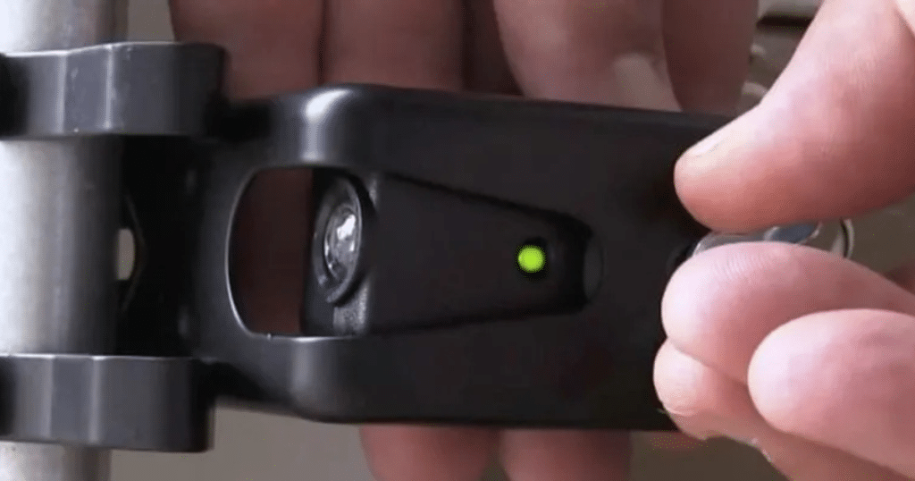 Man unlocks smart lock with a green light.