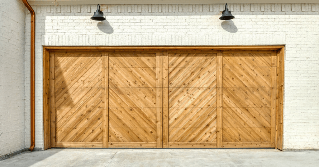Modern double garage door with wood panels.