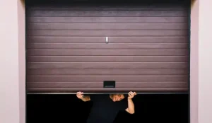 person below garage door